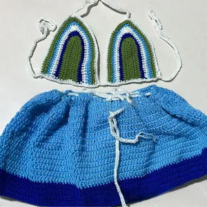 Detailed view of handmade crochet bikini set featuring blue and green wave patterns