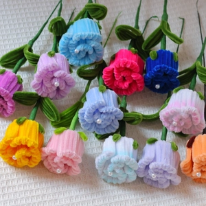 Handmade pipe cleaner bouquet featuring roses and sunflowers with pearl centers