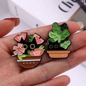 Cute black cat enamel pins with floral and leaf potted plant designs for accessories