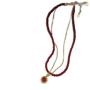 Double-layered tiger eye bead necklace with gold plated chain and round gem pendant