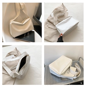 Detailed views of creamy white tote bag showing spacious interior and wide strap