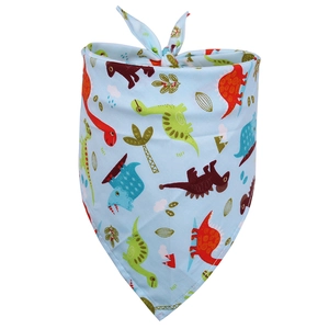 Detail shot of light blue cotton dog bandana featuring colorful cartoon dinosaur patterns