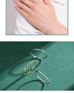 Macro detail of slim S925 silver rings with colorful rainbow stones and turquoise stones