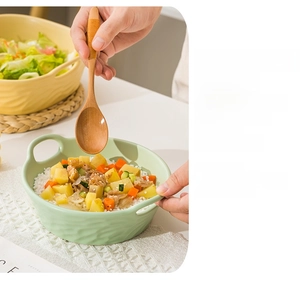 Detail of heat-resistant ceramic baking bowls with handles for oven and microwave use