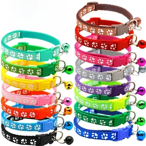 Detailed overview of colorful pet collars featuring paw prints and metal bells