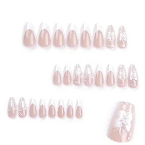 3D bow white French almond press-on nails with floral pearls and star glitters