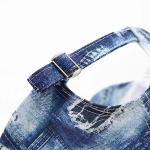 Detail of the vintage denim baseball cap showing the adjustable silver metal buckle and strap