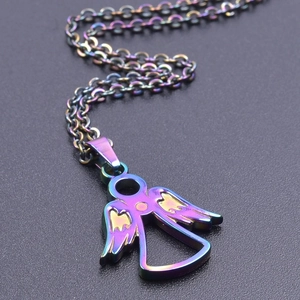 Macro shot of 18k gold plated angel pendant with vibrant rainbow gradient finish detail