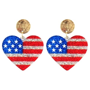 Close-up of heart-shaped USA flag earrings with patriotic glitter texture and gold studs