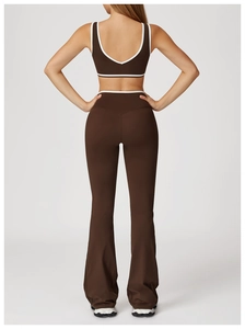 Detail view of the back of chocolate brown yoga set with white contrast trim and U-neck