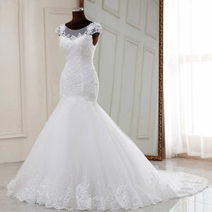 Elegant white mermaid wedding dress with lace embroidery, sequins and long bridal train
