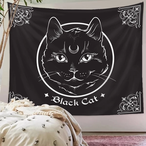 Detail of black cat tapestry with crescent moon hanging over bed in a cozy bedroom