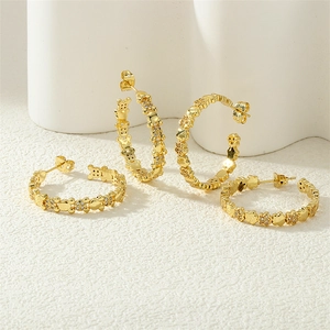 Detailed view of four golden chain earrings featuring micro-set zircon bears and flowers
