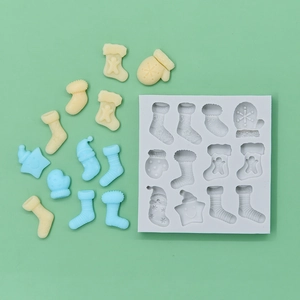 12-cavity silicone Christmas mold featuring stockings, gloves and stars for DIY baking