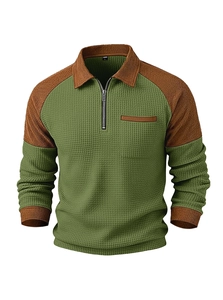 Detail of waffle knit fabric and brown corduroy collar on green men's polo shirt