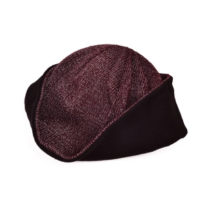 Detail of winter knit hat with reflective yarn and warm black fleece lining inside