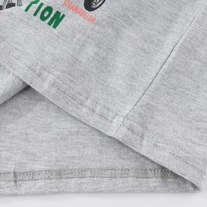 Detail view of double-stitched hem and gray marl knit texture on boys' long-sleeve T-shirt