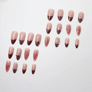 24-piece burgundy French almond press-on nails with floral patterns and small rhinestones