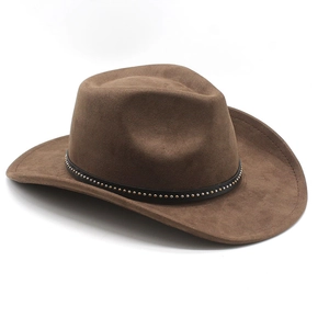 Detail of a brown suede cowboy hat featuring a black leather band with gold rivets