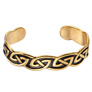 Golden stainless steel Viking Celtic knot open cuff bracelet on white background