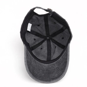 Detail view of retro washed cotton baseball cap interior with adjustable strap and label
