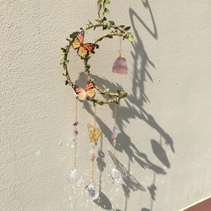 Handmade moon-shaped suncatcher with purple crystal, faux leaves, and crystal prism balls
