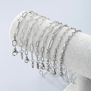 Detailed view of silver stainless steel square wire and paperclip anklet chain styles