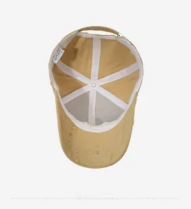 Detail view of khaki cotton baseball cap interior with stitching and metal buckle