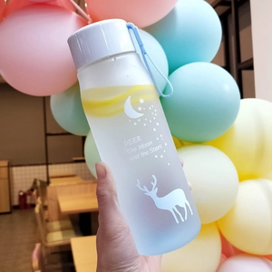 Close-up of matte plastic water bottle with deer and star prints and blue carrying strap