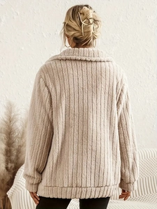 Back view of a beige fuzzy long-sleeved jacket featuring elegant vertical stripe quilting