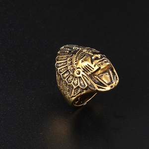 Macro detail of bronze Indian Chief head ring with intricate feather headdress carving