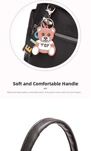 Detail of waterproof nylon backpack featuring cute bear charm and colorful woven straps
