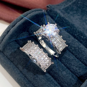 Macro detail of double-layer wedding ring set with sparkling zircon in luxury jewelry box