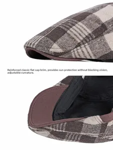 Detail of the reinforced stiff brim and wool blend checkered fabric on this newsboy cap