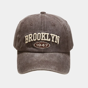 Close-up of vintage washed grey baseball cap with 3D Brooklyn 1947 embroidery details