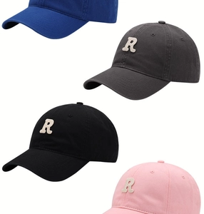 Detail view of cotton baseball caps with embroidered R letters in multiple colors