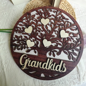 Macro detail of a round wooden family tree plaque with heart charms and Grandkids text