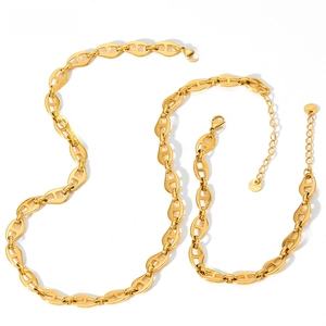 Detail of gold pig nose chain necklace with lobster clasp and stainless steel tag