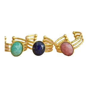 French style open rings in gold with colorful natural stones on white background