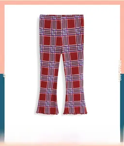 Detailed view of kids red plaid flared leggings with ruffle trim hem and classic pattern