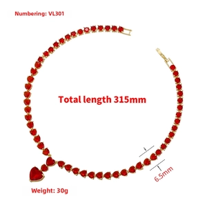 Detail of gold heart pendant necklace with red ruby gemstones and 315mm total length