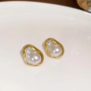 Irregular pearl stud earrings with gold finish, elegant vintage style for women
