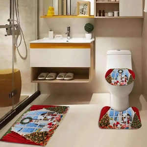 Detailed view of the 3-piece Christmas bathroom mat set with Santa and snowflake motifs