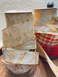 Detail of Christmas ribbons with glitter floral and plaid burlap patterns on rolls