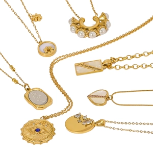 Gold vintage stainless steel necklaces with heart and shell pendants set with zircons