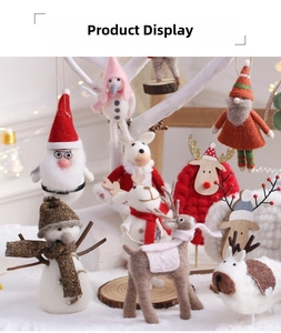 Detailed view of handmade wool felt Christmas ornaments with miniature animals and warm light