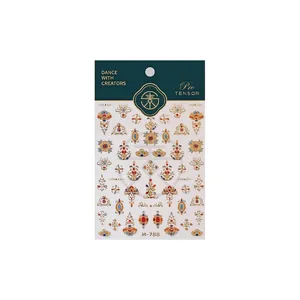 Vintage palace style nail stickers with red and blue gem patterns on white background