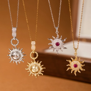 Elegant gold and silver sun starburst necklaces with red ruby and zircon pendants