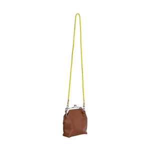 Detail of a brown mini crossbody bag with yellow rope strap and silver kiss-lock clasp