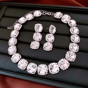Vintage style crystal pendant necklace and earrings set with silver-toned rhinestones